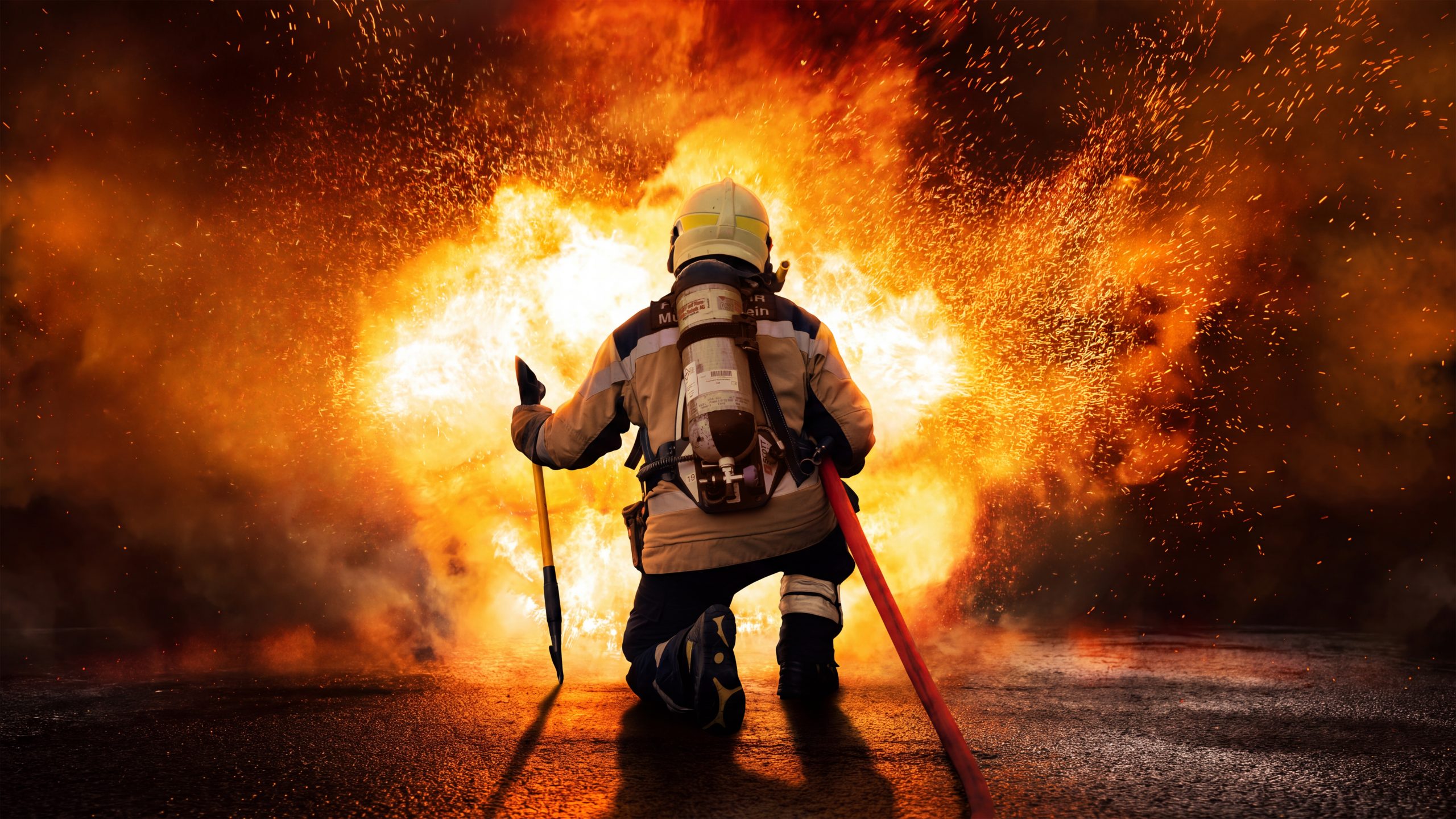 Firefighter in front of a fire.